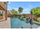 Relaxing pool in backyard with fountain features and desert landscaping with covered patio at 22346 N 104Th Ln, Peoria, AZ 85383