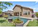 Backyard featuring a sparkling swimming pool with a tanning shelf and well-kept landscaping at 22346 N 104Th Ln, Peoria, AZ 85383