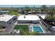 Aerial view of backyard features a pool, patio, artificial turf, and an outdoor seating area at 2320 E Mulberry Dr, Phoenix, AZ 85016