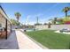 Large backyard features a pool, lounge area, artificial turf, and an outdoor seating area at 2320 E Mulberry Dr, Phoenix, AZ 85016
