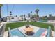 Backyard featuring pool, artificial turf, and outdoor seating areas, perfect for entertaining at 2320 E Mulberry Dr, Phoenix, AZ 85016