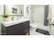 Bathroom with tile flooring, marble tiled shower, modern vanity, and sleek fixtures at 2320 E Mulberry Dr, Phoenix, AZ 85016