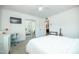 Cozy bedroom featuring a comfortable bed, mirrored closet, and plenty of natural light at 2320 E Mulberry Dr, Phoenix, AZ 85016