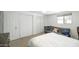 Bright bedroom with white walls, carpet floor, futon, a ceiling fan, and a black metal bed frame at 2320 E Mulberry Dr, Phoenix, AZ 85016