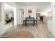 Open dining area with grey table and stools, with views into the living and Gathering room at 2320 E Mulberry Dr, Phoenix, AZ 85016