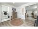 Hallway with a wine rack, laundry room, and views into other living spaces at 2320 E Mulberry Dr, Phoenix, AZ 85016