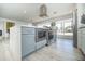 Bright, modern kitchen island featuring a stainless steel oven, microwave, and sleek countertop at 2320 E Mulberry Dr, Phoenix, AZ 85016