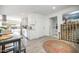 Bright kitchen featuring white cabinetry, stainless steel appliances, and laminate floors with an adjacent dining table at 2320 E Mulberry Dr, Phoenix, AZ 85016