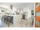 Modern kitchen with stainless steel appliances, a large island, and stylish white cabinetry at 2320 E Mulberry Dr, Phoenix, AZ 85016