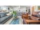 Bright living area with wood floors and a view of the modern kitchen featuring sleek countertops at 2320 E Mulberry Dr, Phoenix, AZ 85016