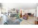 Open-concept living space featuring wood floors, stylish furniture, and a view of the modern kitchen at 2320 E Mulberry Dr, Phoenix, AZ 85016