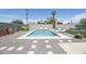 Backyard with swimming pool, patio, artificial grass, hardscape, and lush landscaping at 2320 E Mulberry Dr, Phoenix, AZ 85016