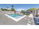 Inviting pool with lounge chairs and grey gravel, surrounded by a block fence for privacy at 2320 E Mulberry Dr, Phoenix, AZ 85016