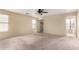 Spacious bedroom featuring neutral walls, a ceiling fan, carpet and closet at 2893 E Cherry Hills Dr, Chandler, AZ 85249