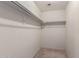 Walk-in closet with ample shelving, storage space, and carpeted floors at 2893 E Cherry Hills Dr, Chandler, AZ 85249