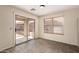 Dining room with a sliding glass door, gray tile floor, and a window with blinds at 2893 E Cherry Hills Dr, Chandler, AZ 85249