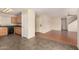 Open-concept kitchen featuring tile floors, wood cabinets, black appliances, and access to the living areas at 2893 E Cherry Hills Dr, Chandler, AZ 85249