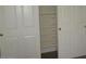 A closet featuring built-in storage shelves and double doors at 3237 E Fremont Rd, Phoenix, AZ 85042