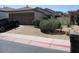 Charming single-level home with a two-car garage and desert landscaping at 3237 E Fremont Rd, Phoenix, AZ 85042