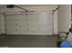A garage featuring a sectional door and ample space at 3237 E Fremont Rd, Phoenix, AZ 85042