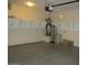 A clean garage featuring storage shelves and utilities at 3237 E Fremont Rd, Phoenix, AZ 85042