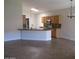 Open-concept kitchen featuring a breakfast bar and tile flooring at 3237 E Fremont Rd, Phoenix, AZ 85042