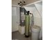 A hot water system with auxiliary equipment in a shelfed space at 3237 E Fremont Rd, Phoenix, AZ 85042