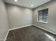 A carpeted bedroom features a window with horizontal blinds offering natural light and a clean, modern design at 32978 N 131St Dr, Peoria, AZ 85383