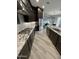 Modern kitchen with stainless steel appliances, a gas cooktop, and a large island at 32978 N 131St Dr, Peoria, AZ 85383