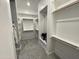 Walk-in closet featuring ample shelving and hanging space, designed for organization and convenience at 32978 N 131St Dr, Peoria, AZ 85383