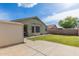 Spacious backyard with a storage shed, lush lawn, and ample space for outdoor activities at 3418 W Maldonado Rd, Phoenix, AZ 85041