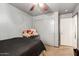 Bedroom with simple furnishings, window for natural light and carpeting at 3418 W Maldonado Rd, Phoenix, AZ 85041