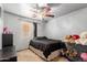 Bedroom with ample space for storage, black furnishings and a window for natural light at 3418 W Maldonado Rd, Phoenix, AZ 85041