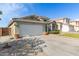 Charming home with a spacious two-car garage, well-maintained landscaping, and a welcoming front entrance at 3418 W Maldonado Rd, Phoenix, AZ 85041