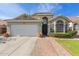 Attractive single-story home featuring a desert-landscaped front yard, brick-lined walkway, and a two-car garage at 3418 W Maldonado Rd, Phoenix, AZ 85041