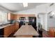 Well-equipped kitchen with ample cabinet space, island with breakfast bar, and modern appliances at 3418 W Maldonado Rd, Phoenix, AZ 85041