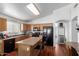 Bright kitchen features black appliances, an island with bar stools, and wood cabinets at 3418 W Maldonado Rd, Phoenix, AZ 85041