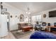 Bright living room with neutral paint, tile floors, and large windows at 3418 W Maldonado Rd, Phoenix, AZ 85041
