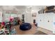 Living room filled with boxes, a beanbag chair, and an arched window at 3418 W Maldonado Rd, Phoenix, AZ 85041