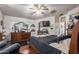 Well-lit main bedroom with a ceiling fan, wood floors, and ample dresser space at 3418 W Maldonado Rd, Phoenix, AZ 85041