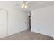 Bedroom with neutral carpet, white walls, and closet door at 3511 E Baseline Rd # 1085, Phoenix, AZ 85042