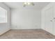 Neutral carpeted bedroom with white walls, window with blinds, and ceiling fan at 3511 E Baseline Rd # 1085, Phoenix, AZ 85042