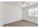 Cozy bedroom with a ceiling fan, neutral carpet, and window with natural light at 3511 E Baseline Rd # 1085, Phoenix, AZ 85042