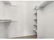 Walk-in closet with white walls and shelving with neutral carpet at 3511 E Baseline Rd # 1085, Phoenix, AZ 85042