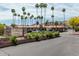 Community entrance featuring beautiful desert landscaping and clear signage for the Shadow Mountain Villas at 3511 E Baseline Rd # 1085, Phoenix, AZ 85042