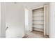 Hallway with carpeted floors and built in storage space at 3511 E Baseline Rd # 1085, Phoenix, AZ 85042
