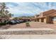 Exterior of a community showing parking with covered parking spots available to residents at 3511 E Baseline Rd # 1085, Phoenix, AZ 85042