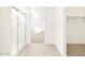 Bathroom featuring a glass-enclosed shower and a walk in closet at 37069 W Prado St, Maricopa, AZ 85138