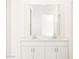 Bathroom vanity featuring dual sinks, white cabinetry, and a large mirror at 37069 W Prado St, Maricopa, AZ 85138