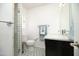 Well-lit bathroom featuring a vanity, sink, mirror, toilet, and decorative floor tiles at 4010 E Catalina Dr, Phoenix, AZ 85018
